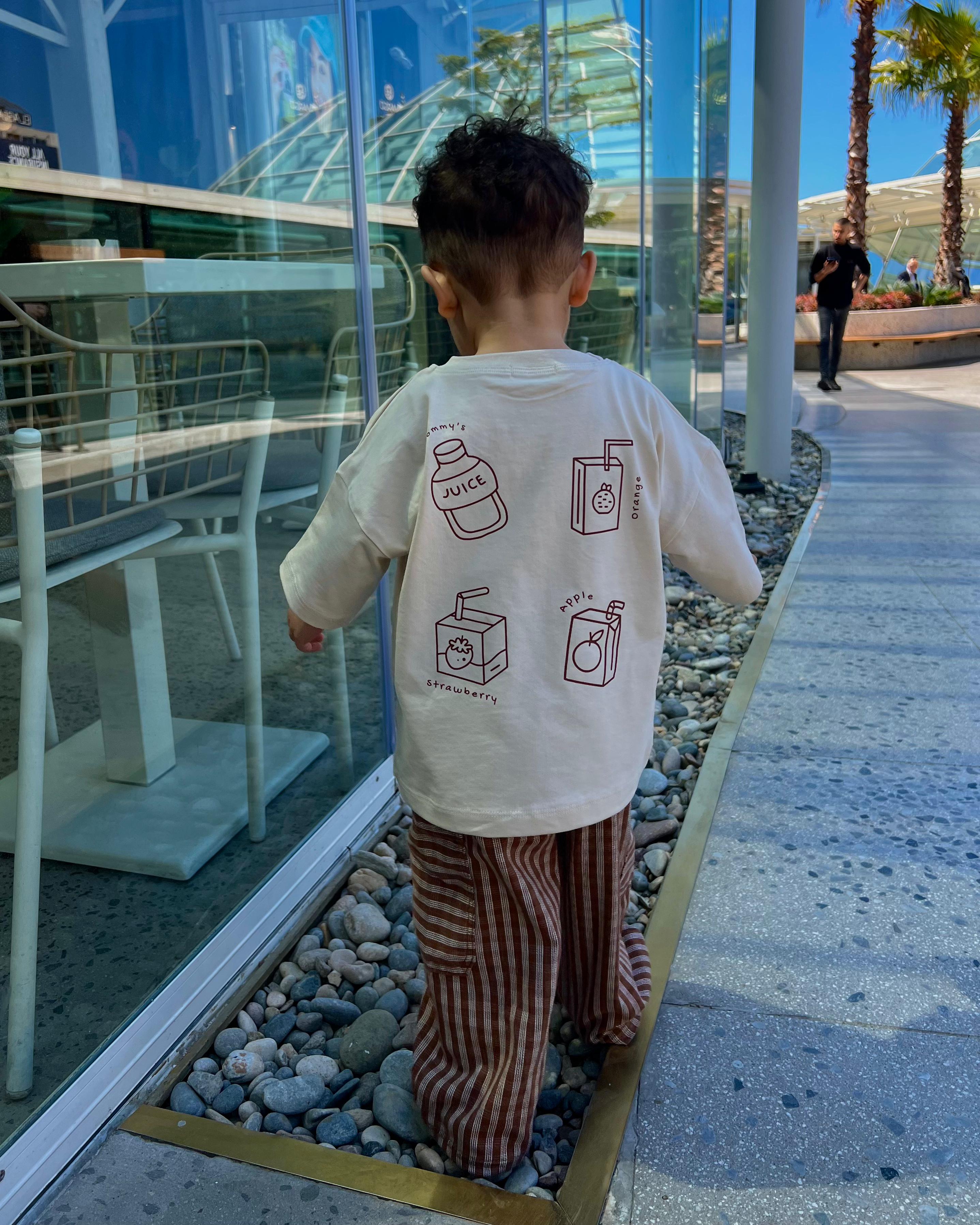 Lifestyle back view featuring Boo and Coo mocha check cargo pants outfit