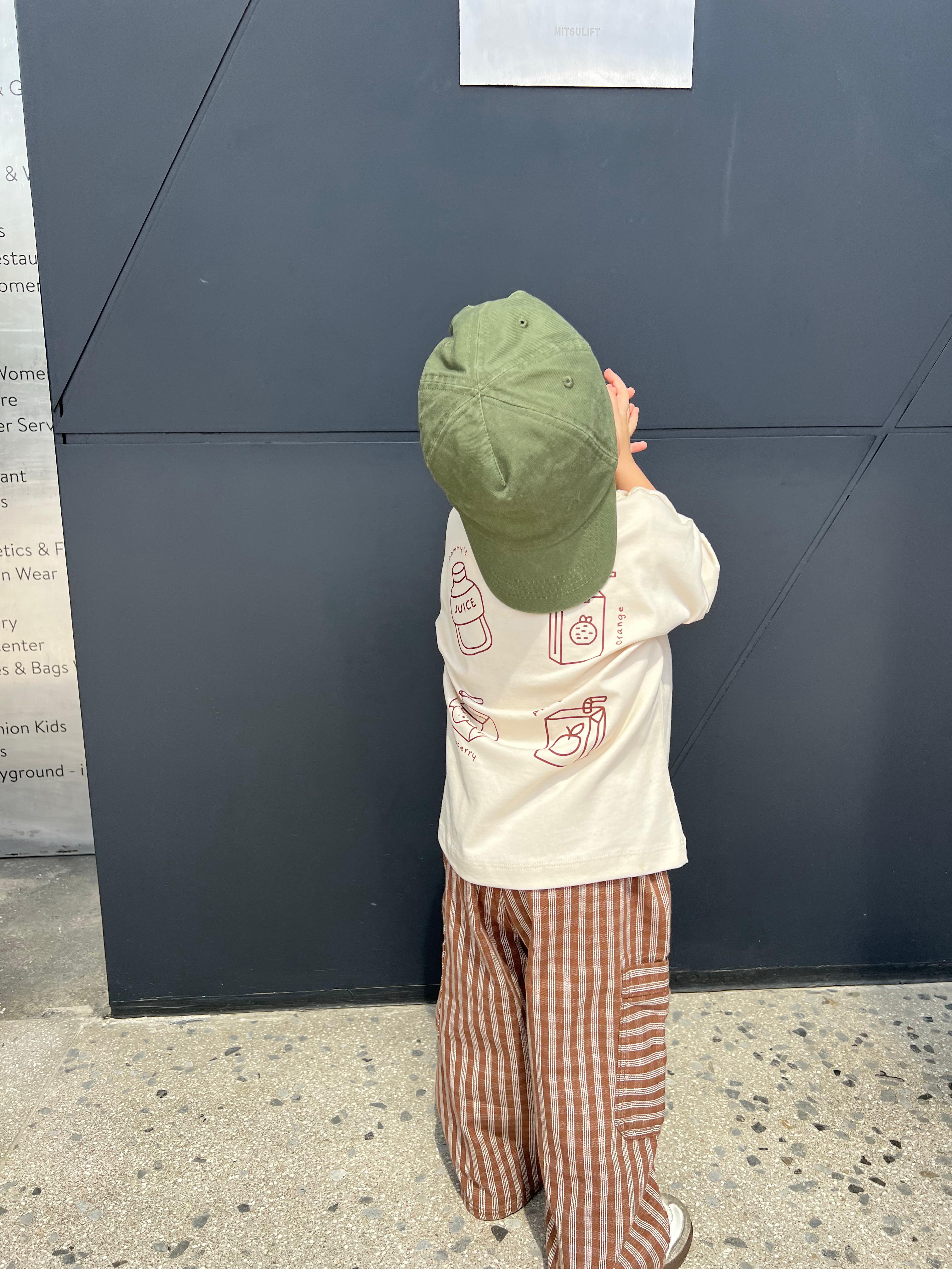 Back view of toddler wearing Boo and Coo mocha check cargo pants